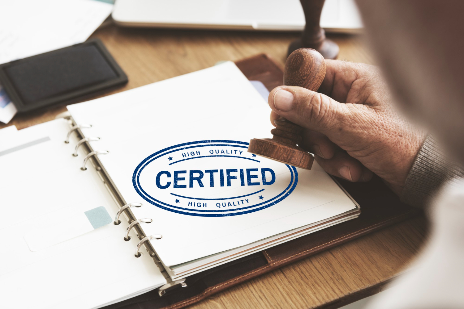 Hand stamping a document as certified